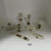 8 items of crested china including long case clocks