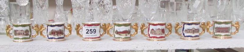 7 miniature Paragon loving cups depicting palaces