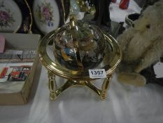 A jewelled globe incorporating compass