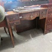 A Victorian inlay and ivory kneehole desk