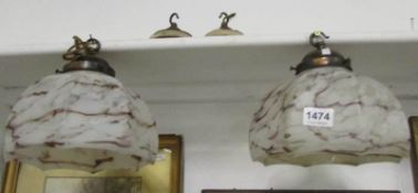 A pair of 1930's glass lampshades with fittings
