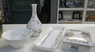 A Wedgwood trinket box, vase, dish and pen tray