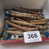 A box of assorted lace bobbins