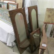 A pair of mahogany framed mirrors with shelves and 1 other