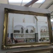 A gilt framed mirror