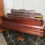 A three quarter grand piano