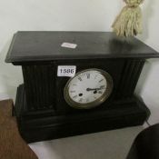 A black marble mantle clock,