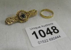 A Victorian gold brooch and a gold wedding band