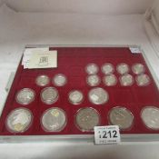 A tray of silver proof Â£1 coins, crowns and dollars