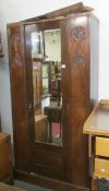 A carved front wardrobe with mirrored door, a/f