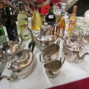 A silver plate tea set, odd teapots, coffee pot etc