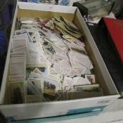 A box of mixed loose cigarette and other cards