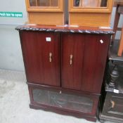 A mahogany effect TV cabinet