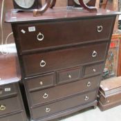 A mahogany effect chest of drawers