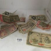 A mixed lot of old bank notes including Japanese and British Armed Services