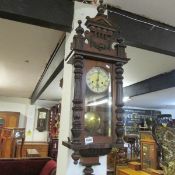 A mahogany wall clock.