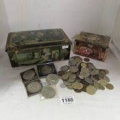 A mixed lot of coins and 2 old tins