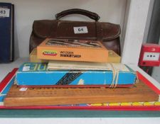 A quantity of old games and leather cased bowls