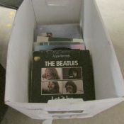 A quantity of Beatles and solo singles, some early pressings