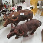 2 carved wood buffalo