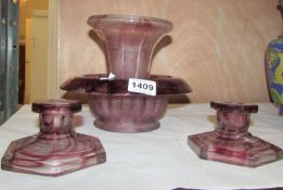 An amethyst cloud glass centrepiece and pair of candlesticks