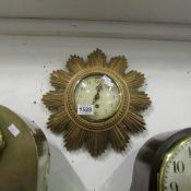 An Art Deco gilded sunburst wall clock