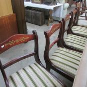 A set of 4 chairs with brass inlay