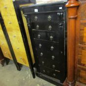 An ebonised 7 drawer Wellington chest