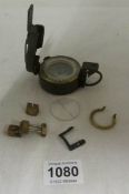 A WW2 military compass with spares