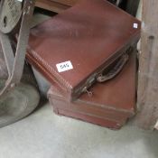 3 vintage graduated leather suitcases