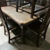 An extending dining table with one leaf