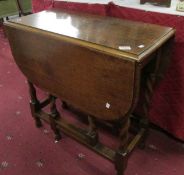 An oak barley twist gate leg table