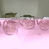A set of 3 graduated jugs stamped Mrs R A Hutchinson
