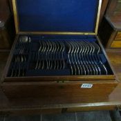 A part canteen of cutlery in mahogany case