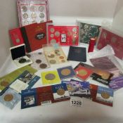 A box of mixed coins and presentation sets including 1966 World Cup