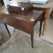 An oak dropleaf table