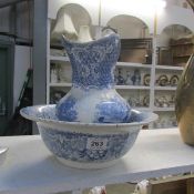 A blue and white jug and basin set