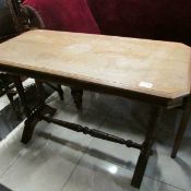 A Victorian stretcher base table