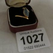 An 18ct gold ring set turquoise coloured stone, size 0