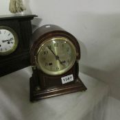 A mahogany inlaid mantel clock