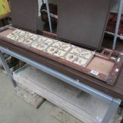 A tiled washstand back, missing some tiles