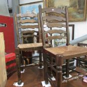 A set of 6 oak ladder back chairs