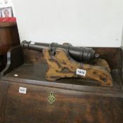 A model cannon with heraldic markings