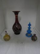 An etched ruby glass vase and 3 scent bottles (1 missing stopper)