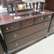 A mahogany effect chest of drawers