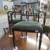 A mahogany dining table and 6 chairs