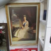 A gilt framed photogaph of Her Majesty Queen Elizabeth II