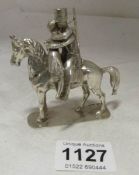 A silver horse surmounted Cossack and lady, approx.248gms