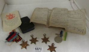 A quantity of WW2 medals, New Testament etc