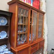 A yew wood effect wall cabinet